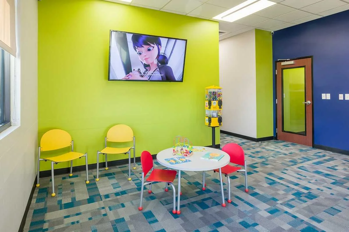 Bright Star Kids Dentistry children's waiting area with play table and chairs