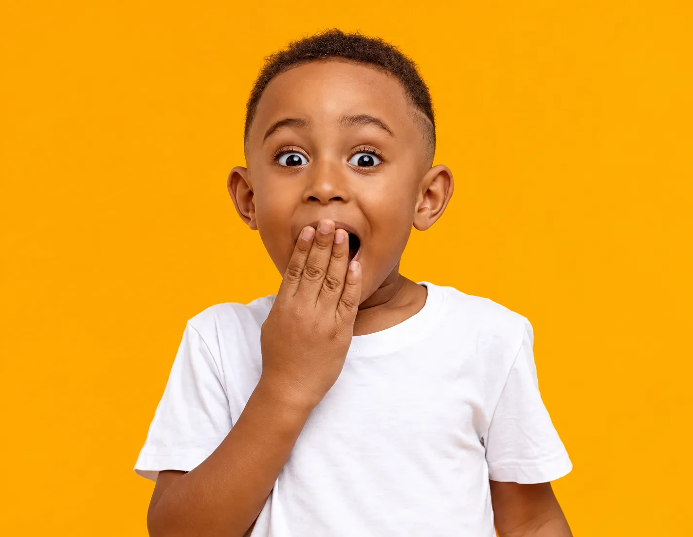 Child with a curious expression learning about dental care