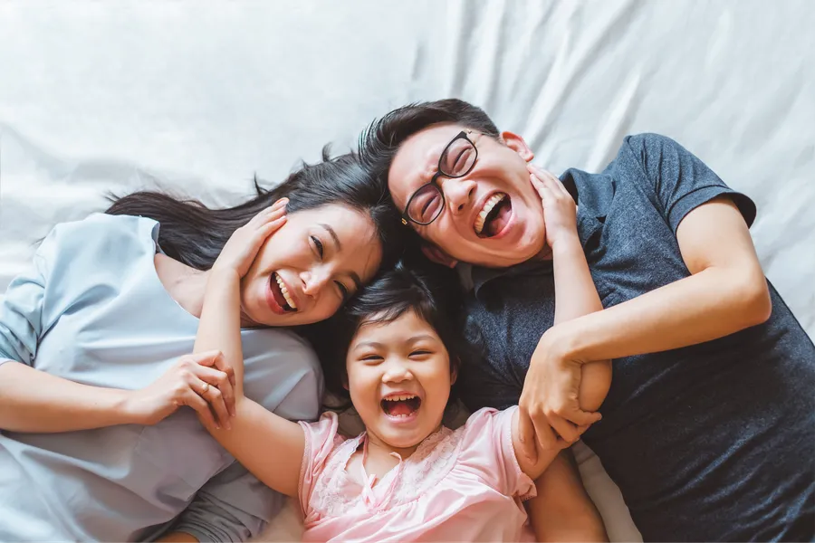 Family laughing together during a home-care routine