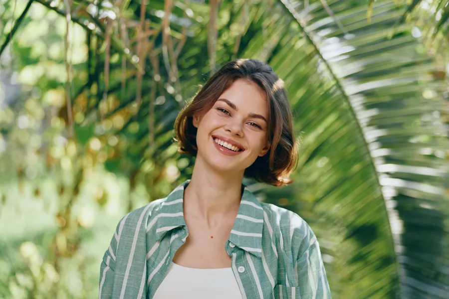 Smiling person representing supportive dental care